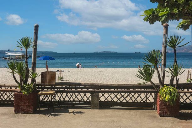 A beautiful beach scene flanked with Dracaena plants. At a resort in Barretto Beach, a popular tourist spot near Subic in Olongapo, Zambales.